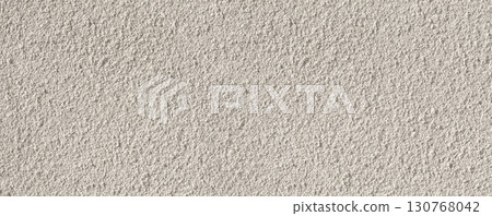 White rough plaster wall texture providing seamless background 130768042