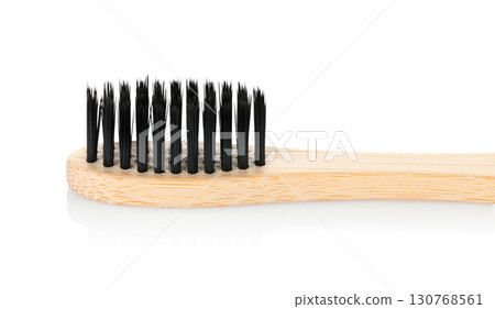 Bamboo toothbrush, isolated on transparent background, full focus for sharp detail. Eco oral care accessory, sustainable hygiene tool for daily dental cleaning routine 130768561