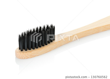 Bamboo toothbrush, isolated on transparent background, full focus for sharp detail. Eco oral care accessory, sustainable hygiene tool for daily dental cleaning routine 130768562