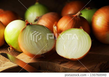 Halved onion and lots of onions Halved onion and lots of onions 130768940