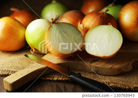 Halved onion and lots of onions 130768943