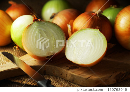 Halved onion and lots of onions 130768946