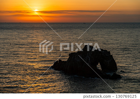 Hinode Stone Gate and the rising sun 130769125