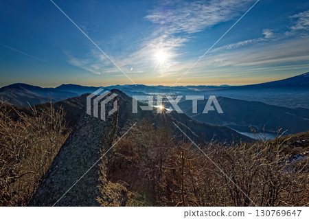 View of Onigaiwa Rock from the summit of Mt. Onigatake in the Misaka Mountains and Lake Kawaguchi in winter 130769647