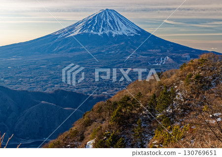 The summit of Mt. Fuji seen from Onigatake in the Misaka Mountains in winter 130769651