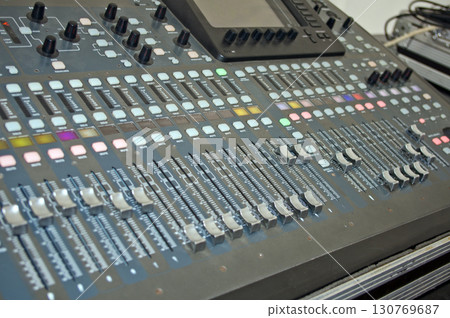 Audio Console. Professional concert sound mixer panel with sliders and regulators Audio Console. Professional concert sound mixer panel with sliders and regulators 130769687
