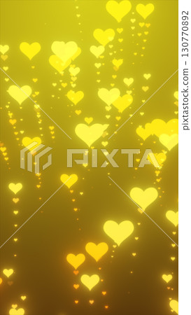 Bright golden hearts floating upward on a glowing yellow background, symbolizing love and celebration 130770892