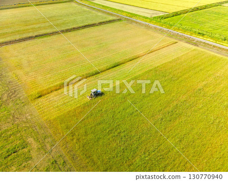 Aerial shot of grass cutting in Esashi Town, Hokkaido in early autumn Aerial shot of grass cutting in Esashi Town, Hokkaido in early autumn 130770940