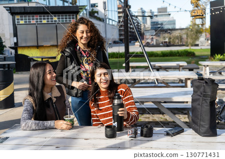 Three latin american women sharing mate in buenos aires Three latin american women sharing mate in buenos aires 130771431