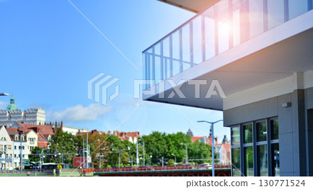 Modern apartment buildings on a sunny day with a blue sky. Facade of a modern apartment building. Modern residential apartment building complex condo. Modern apartment buildings on a sunny day with a blue sky. Facade of a modern apartment building. Modern residential apartment building complex condo. 130771524