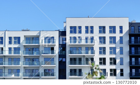 Architectural details of modern apartment building. Modern european residential apartment building complex. Architectural details of modern apartment building. Modern european residential apartment building complex. 130772010