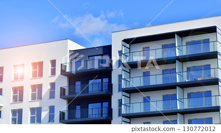 Architectural details of modern apartment building. Modern european residential apartment building complex. 130772012