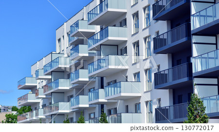 Architectural details of modern apartment building. Modern european residential apartment building complex. Architectural details of modern apartment building. Modern european residential apartment building complex. 130772017