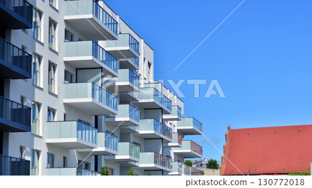 Architectural details of modern apartment building. Modern european residential apartment building complex. Architectural details of modern apartment building. Modern european residential apartment building complex. 130772018