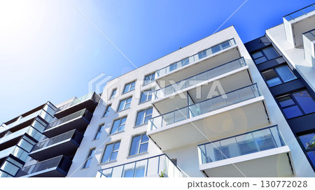 Architectural details of modern apartment building. Modern european residential apartment building complex. 130772028
