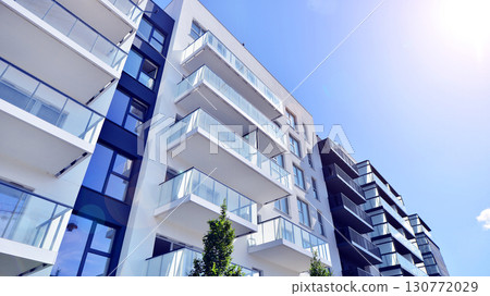 Architectural details of modern apartment building. Modern european residential apartment building complex. Architectural details of modern apartment building. Modern european residential apartment building complex. 130772029