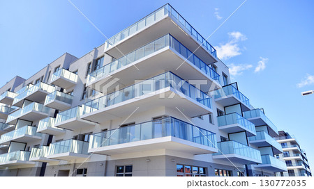 Architectural details of modern apartment building. Modern european residential apartment building complex. 130772035