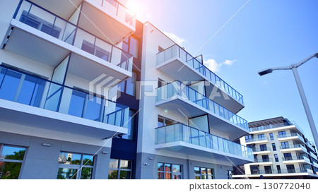 Architectural details of modern apartment building. Modern european residential apartment building complex. 130772040