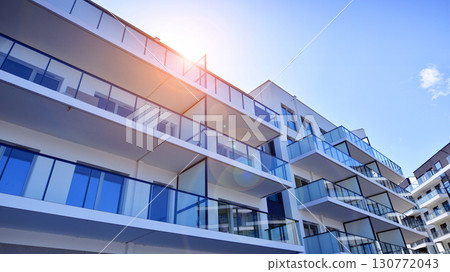 Architectural details of modern apartment building. Modern european residential apartment building complex. Architectural details of modern apartment building. Modern european residential apartment building complex. 130772043