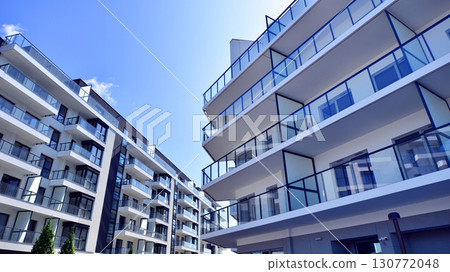 Architectural details of modern apartment building. Modern european residential apartment building complex. 130772048