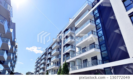 Architectural details of modern apartment building. Modern european residential apartment building complex. 130772049