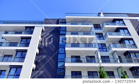 Architectural details of modern apartment building. Modern european residential apartment building complex. 130772054