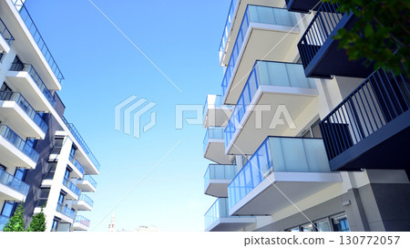 Architectural details of modern apartment building. Modern european residential apartment building complex. Architectural details of modern apartment building. Modern european residential apartment building complex. 130772057