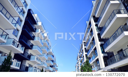 Architectural details of modern apartment building. Modern european residential apartment building complex. Architectural details of modern apartment building. Modern european residential apartment building complex. 130772070