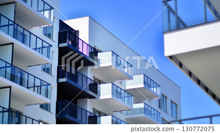 Architectural details of modern apartment building. Modern european residential apartment building complex. Architectural details of modern apartment building. Modern european residential apartment building complex. 130772075