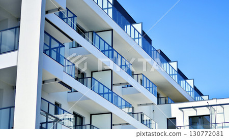 Architectural details of modern apartment building. Modern european residential apartment building complex. Architectural details of modern apartment building. Modern european residential apartment building complex. 130772081
