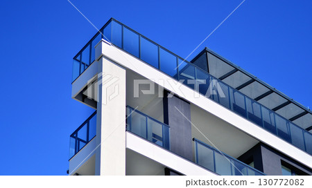 Architectural details of modern apartment building. Modern european residential apartment building complex. 130772082