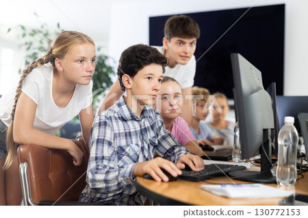Group of students working at computer in classroom Group of students working at computer in classroom 130772153