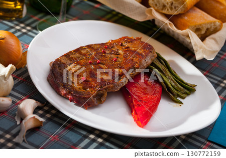 Grilled beef with stewed green beans and pepper 130772159