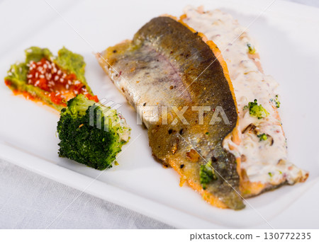 Grilled trout with broccoli and tartar Grilled trout with broccoli and tartar 130772235