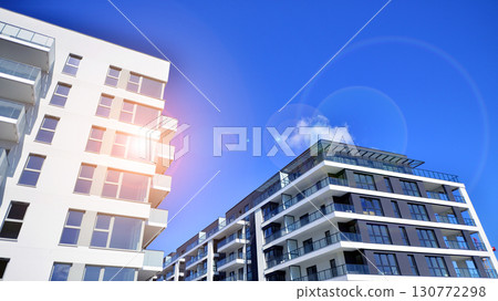 Architectural details of modern apartment building. Modern european residential apartment building complex. Architectural details of modern apartment building. Modern european residential apartment building complex. 130772298