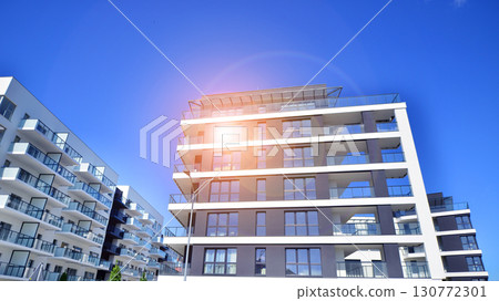 Architectural details of modern apartment building. Modern european residential apartment building complex. Architectural details of modern apartment building. Modern european residential apartment building complex. 130772301