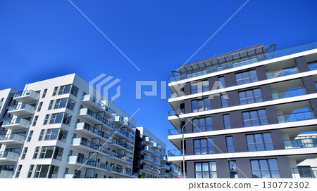 Architectural details of modern apartment building. Modern european residential apartment building complex. 130772302