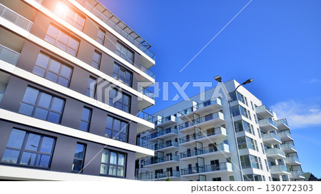 Architectural details of modern apartment building. Modern european residential apartment building complex. 130772303