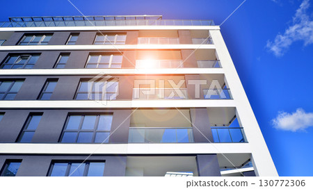 Architectural details of modern apartment building. Modern european residential apartment building complex. Architectural details of modern apartment building. Modern european residential apartment building complex. 130772306