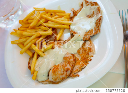 Pork steaks with fries 130772328