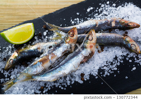 Slate of baked in oven anchovies 130772344