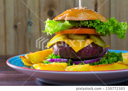 Burger with big meat rissole Burger with big meat rissole 130772383