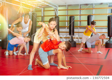 Children self defense training in gym Children self defense training in gym 130772504
