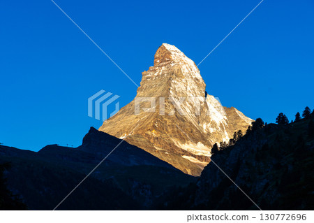 Scenic sunrise view of Matterhorn, one of the most famous and ic 130772696