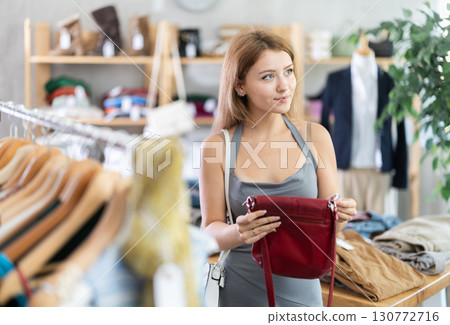 Young women choosing handbag in store 130772716