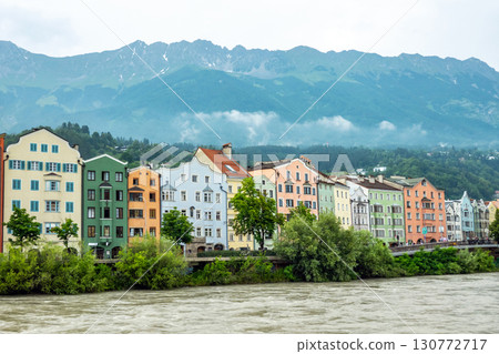 Innsbruck in cloudy day with sun, Austria town with colorful hou Innsbruck in cloudy day with sun, Austria town with colorful hou 130772717