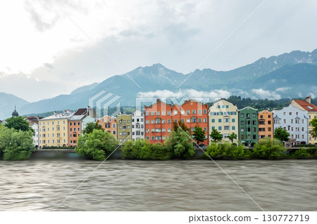 Innsbruck in cloudy day with sun, Austria town with colorful hou 130772719