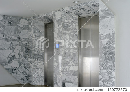 Mable metallic silver elevator door for branding with concrete w 130772870