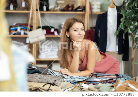 Young woman posing in clothing store Young woman posing in clothing store 130772995
