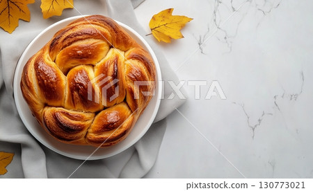 Pumpkin roll bread pastry snack dessert food homemade on white plate 130773021